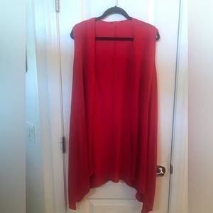 Long red vest/over piece.